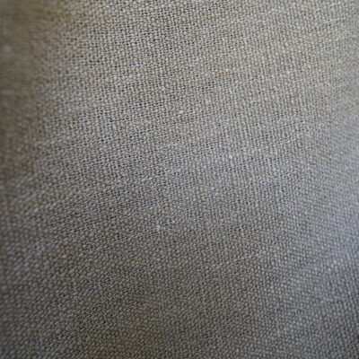 High-quality linen fabric product promotional image, showcasing its natural texture and soft neutral tones, creating an elegant and comfortable atmosphere, suitable for use in sofas, curtains, and home decor