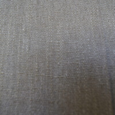 High-quality linen fabric product promotional image, showcasing its natural texture and soft neutral tones, creating an elegant and comfortable atmosphere, suitable for use in sofas, curtains, and home decor